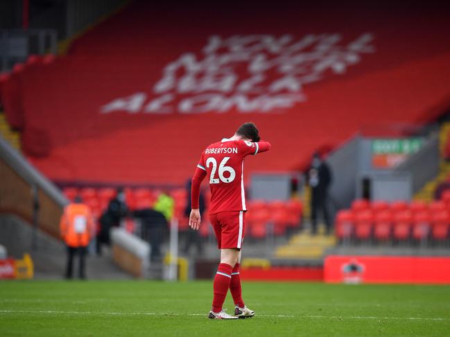 Liverpool defender Andrew Robertson walks alone after the final whistle. (Photo by Paul ELLIS / POOL / AFP)