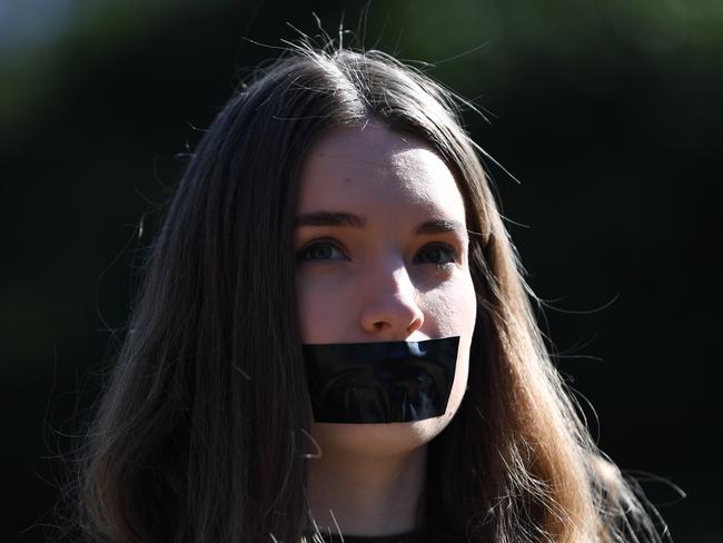 A student of the Australian National University participates in a protest after the release of the Australian Human Rights Commission report. Picture: Lukas Coch/AAP