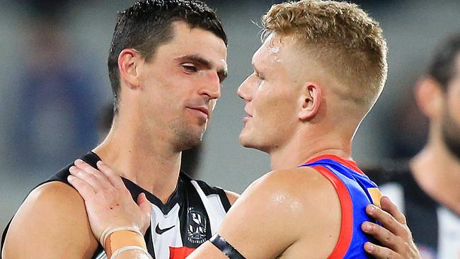 Former teammates Scott Pendlebury and Adam Treloar embrace in Round 1 after the Western Bulldogs beat Collingwood. Picture: Mark Stewart