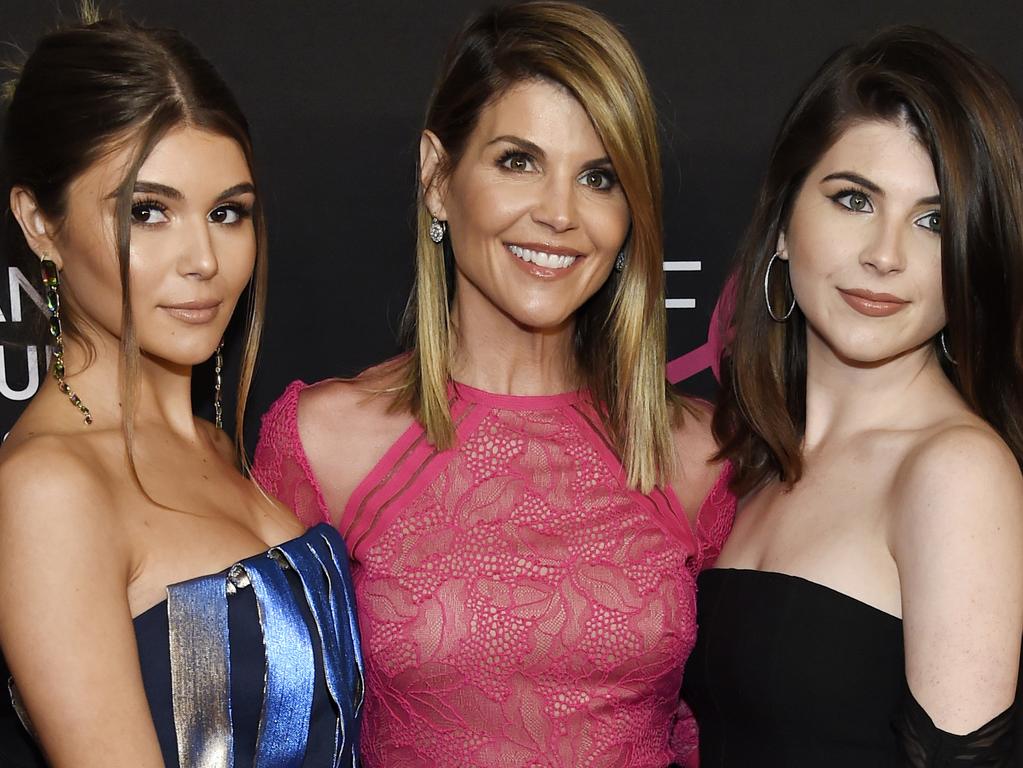 Lori Loughlin, centre, poses with daughters Olivia Jade Giannulli, left, and Isabella Rose Giannulli. Picture: AP 