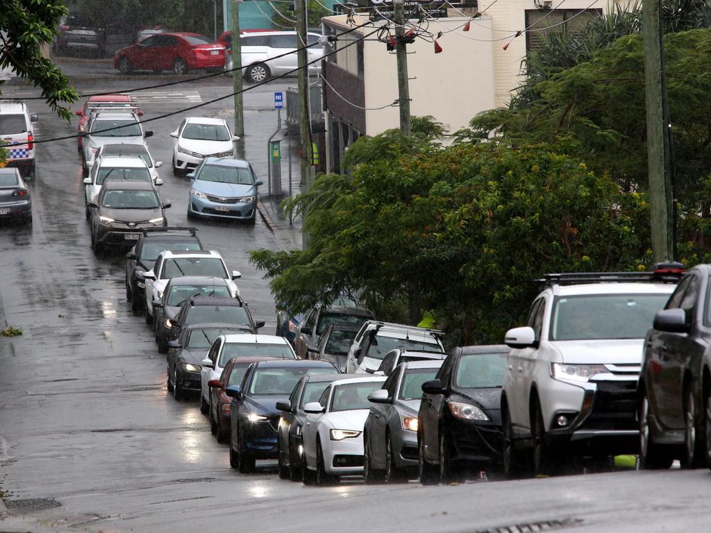 Drivers queue for a Covid-19 test at Sullivan Nicolaides Pathology at Bowen Hills, Queensland. Picture David Clark