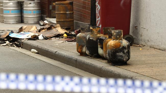 Gas bottles were among the burned items outside the Sporting Globe after a fire overnight. Picture: Alison Wynd