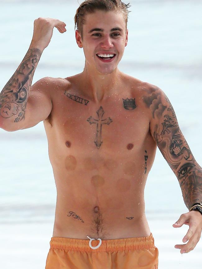 STRICTLY NO ONLINE USE UNTIL MIDNIGHT MUST CREDIT KHAPGG/MATRIX WEB AND PRINT RIGHTS AVAILABLE FOR USE/FEE INVOLVED - CONTACT NEIL BENNETT **EXCLUSIVE** Justin Bieber spotted swimming at Bondi Iceberg in Sydney.