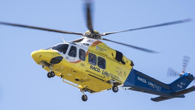 Rescue mission after man trapped under tree on Qld property