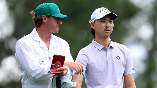 AUGUSTA, GEORGIA - APRIL 11: Min Woo Lee of Australia and his caddie prepare for a shot from the fourth tee during the first round of the 2024 Masters Tournament at Augusta National Golf Club on April 11, 2024 in Augusta, Georgia.   Andrew Redington/Getty Images/AFP (Photo by Andrew Redington / GETTY IMAGES NORTH AMERICA / Getty Images via AFP)