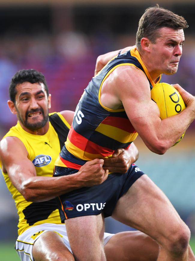 Brad Crouch is tackled by Marlion Pickett in Round 18.