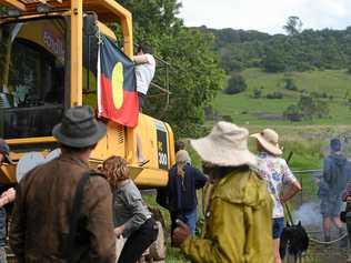 Community supporters and protesters at the site after performing a sacred fire and smoking ceremony to protest the controversial North Lismore Plateau development. Picture: Marc Stapelberg