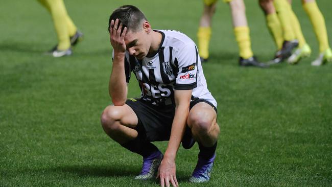 Adelaide City winger Joel Allwright contemplates the Black and Whites’ SA Premier League grand final loss to Croydon Kings. Picture: AAP Image/Morgan Sette