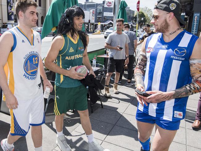 Odd couple Andrew Bogut and Liz Cambage (Anthony Miles and Sam Lloyd) cross paths with Dustin Martin (Brandon Ellis). Picture: Jason Edwards