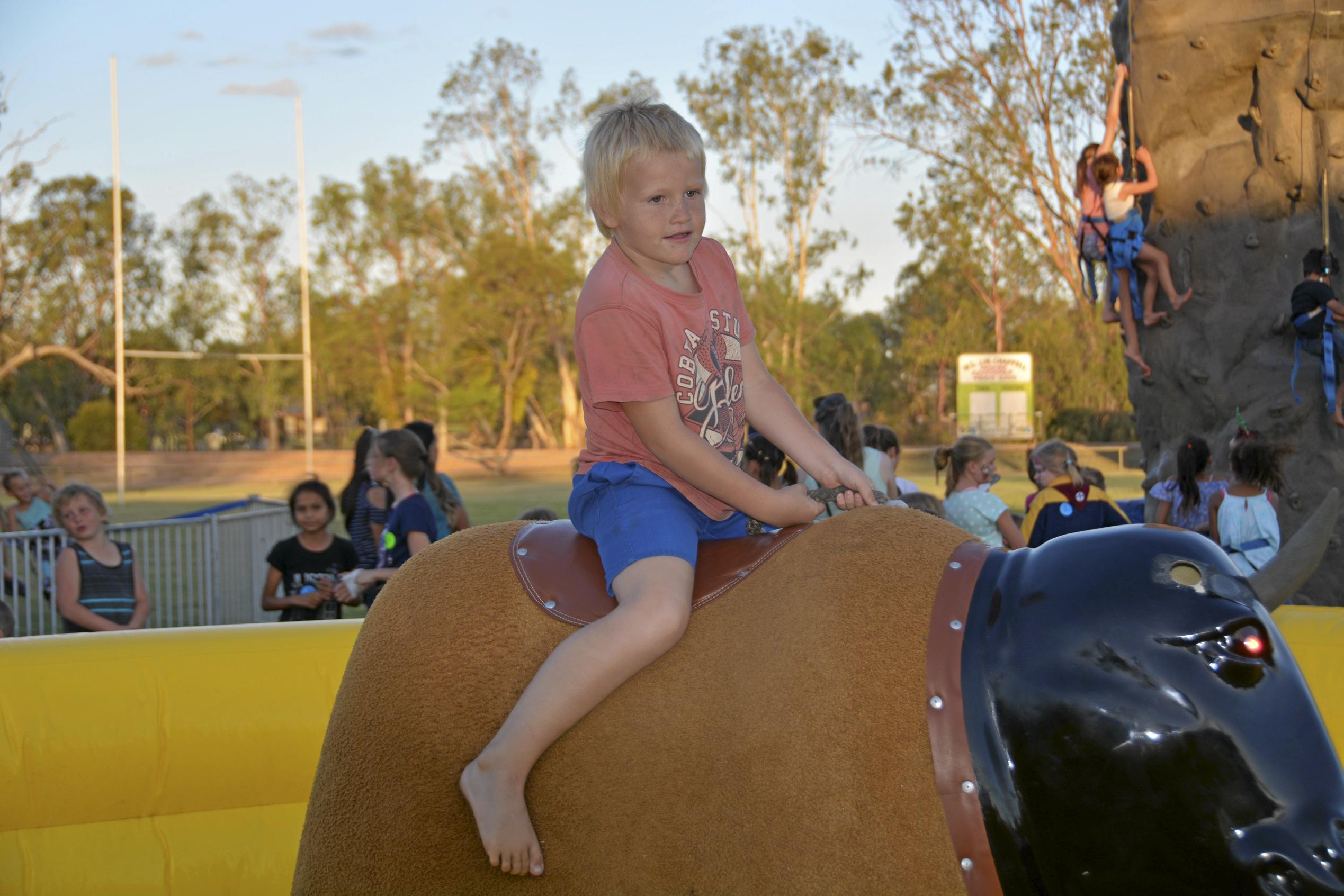 Ronan Eveleigh rides the mecanical bull at the Tara Christmas Carnival 081218. Picture: Eloise Quinlivan