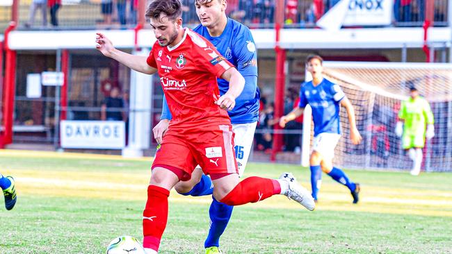 Campbelltown City's Marc Marino (red) in NPL action at Steve Woodcock Centre. Picture: Ken Carter