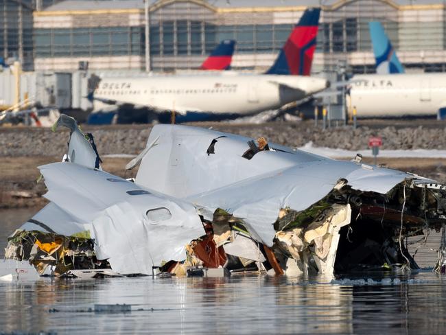 WASHINGTON, DC - JANUARY 30: (EDITOR'S NOTE: This Handout image was provided by a third-party organization and may not adhere to Getty Images' editorial policy.)  In this U.S. Coast Guard handout, the Coast Guard investigates aircraft wreckage on the Potomac River on January 30, 2025 in Washington, DC. An American Airlines flight from Wichita, Kansas collided midair with a military Black Hawk helicopter while on approach to Ronald Reagan Washington National Airport outside of Washington, DC. According to reports, there were no survivors among the 67 people onboard both aircraft.  (Photo by Petty Officer 1st Class Brandon Giles/ U.S. Coast Guard via Getty Images)