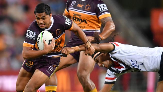 Anthony Milford breaks a Sitili Tupouniua tackle. Picture: AAP Image/Darren England