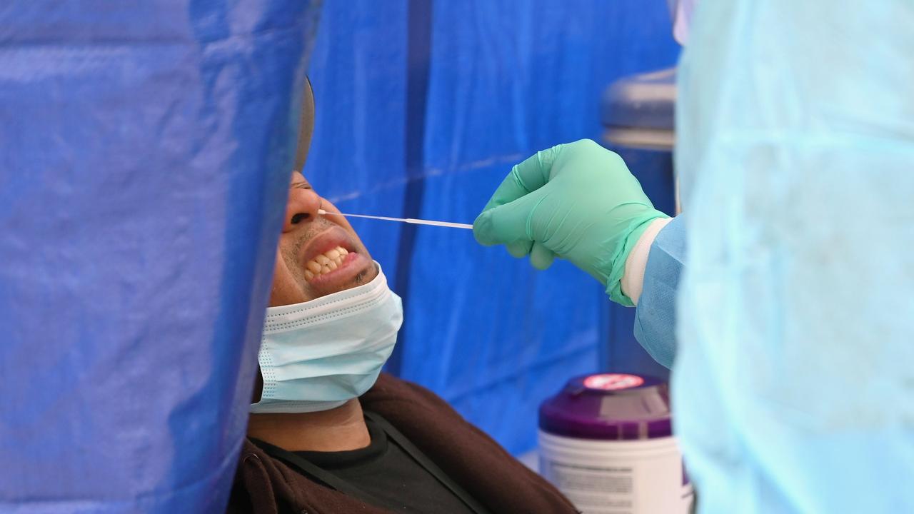 A healthcare worker takes a nasal swab sample in New York City. Picture: Angela Weiss/AFP