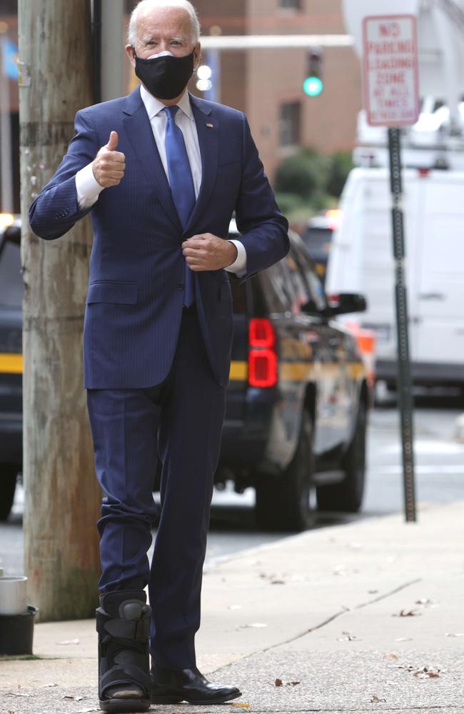 President-elect Joe Biden wearing a walking boot due to hairline fractures after he strained his ankle playing with his dog Major. Picture: Getty/AFP