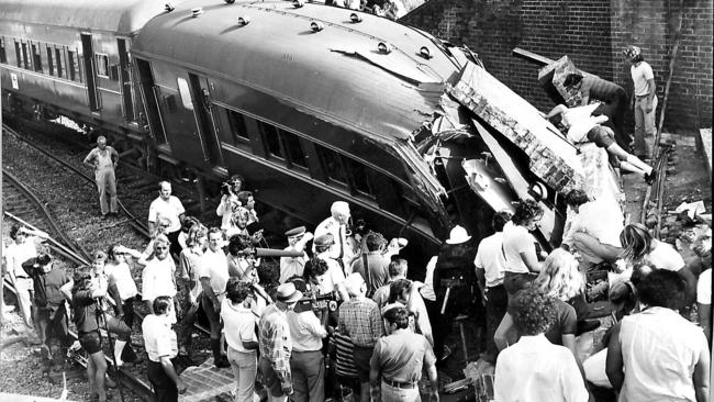 It was a terrifying scene at Granville in the minutes following the crash, with ambulance workers and passers-by rushing to trapped victims aid. Picture: Archive News Corp