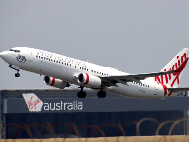 Virgin Australia plane departing from Brisbane Airport Pictures David Clark Photography