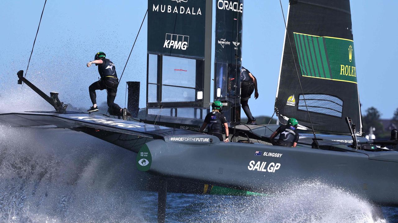 The crew of SailGP team Australia competing on Sydney Harbour in season four.