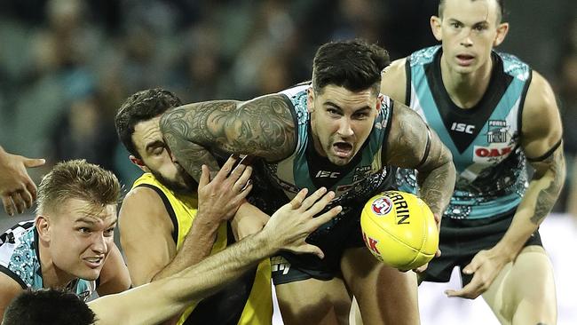 AFL - 08/06/18 - Port Adelaide v Richmond at The Adelaide Oval. Chad Wingard under pressure to gets his handpass out from Shane Edwards. Picture Sarah Reed