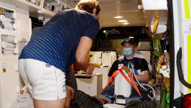 Tom Stewart greets Angus in the ambulance upon arrival. Picture: Michael Klein.