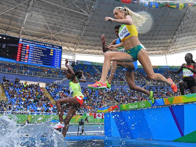 (L-R) Ethiopia's Etenesh Diro, India's Lalita Shivaji Babar, Australia's Genevieve Lacaze and Kenya's Lydia Chebet Rotich compete in the Women's 3000m Steeplechase Final during the athletics competition at the Rio 2016 Olympic Games at the Olympic Stadium in Rio de Janeiro on August 15, 2016. / AFP PHOTO / FRANCK FIFE