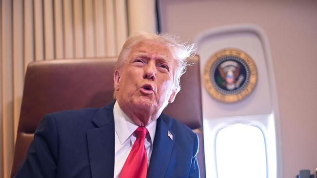 US President Donald Trump speaks to the press after signing a proclamation renaming the Gulf of Mexico as the Gulf of America aboard Air Force One.