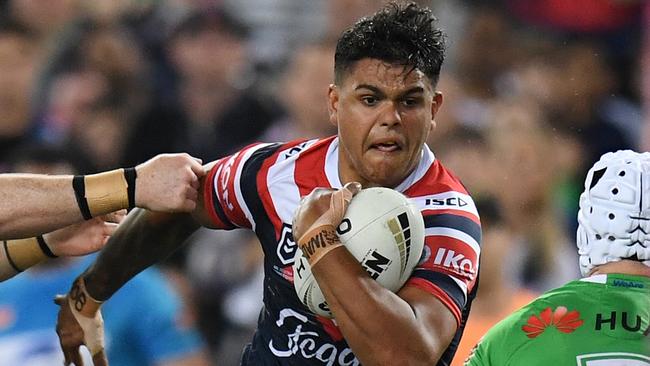 Latrell Mitchell of the Roosters in action.