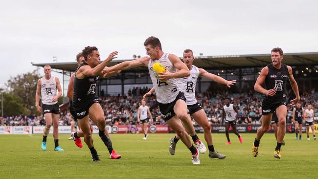 Joe Atley fending off Karl Amon in Port’s internal trial. Picture: Matt Turner/AFL Photos via Getty Images