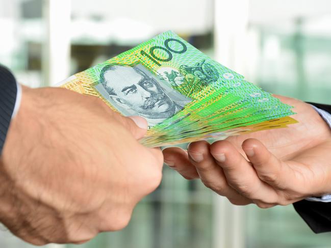 Hands of businessmen passing money, Australian money, notes,  income, generic