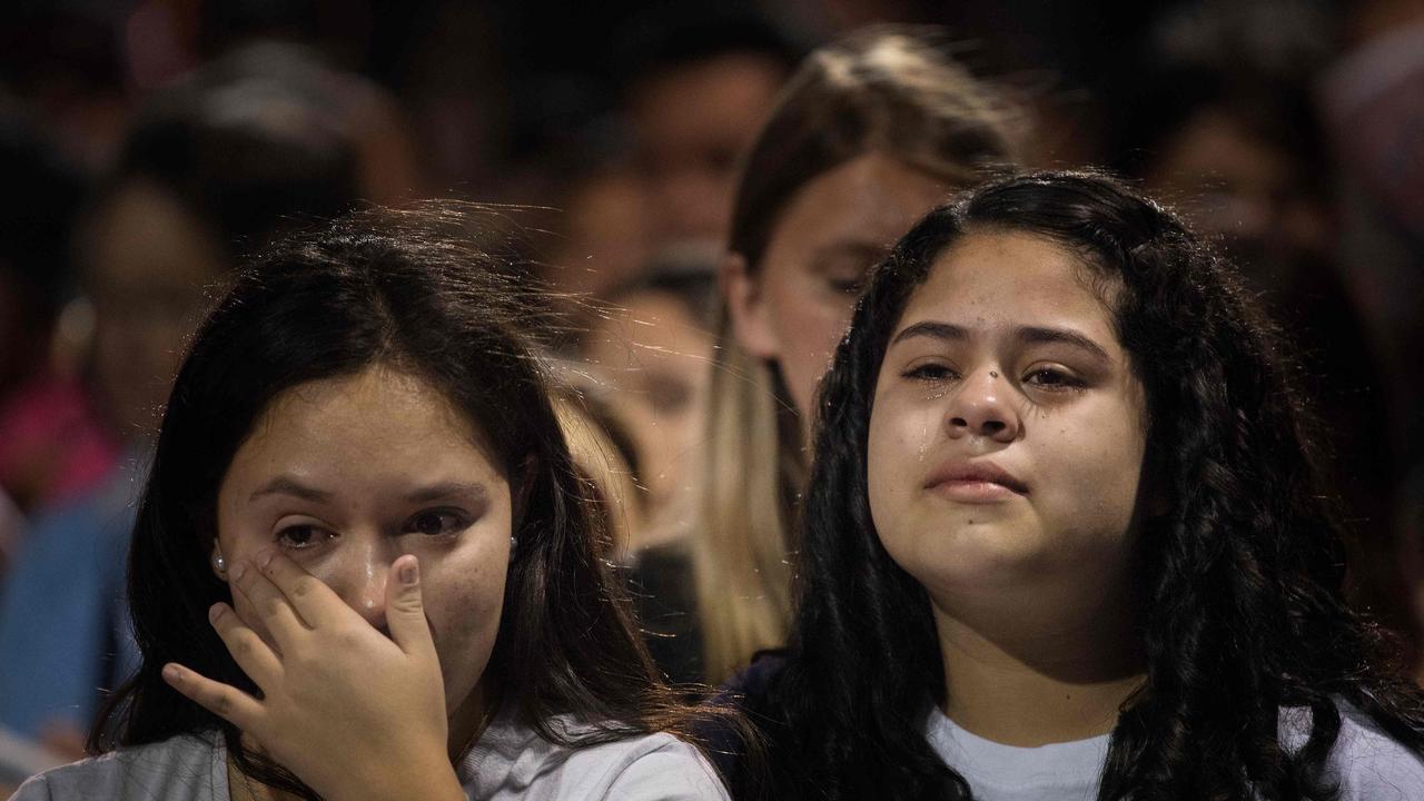 People react during a prayer and candle vigil organised by the city, after a shooting left 20 people dead at the Cielo Vista Mall WalMart in El Paso, Texas. Picture: Mark Ralston/ AFP