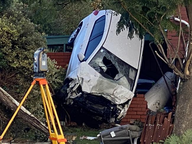 A car has become airborne in a crash on Goodwood road overnight , 28th June 2013 . Picture: Roy Vandervegt