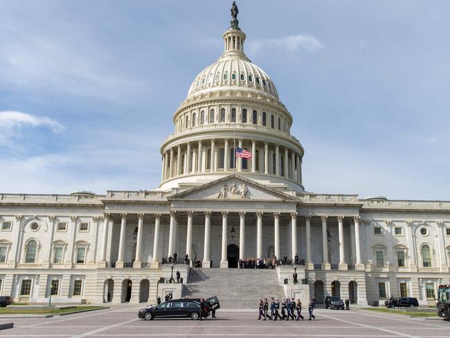 A Military Honor Guard carries the casket of Reverend Billy Graham as it arrives at the US Capitol in Washington, DC. Picture: AFP
