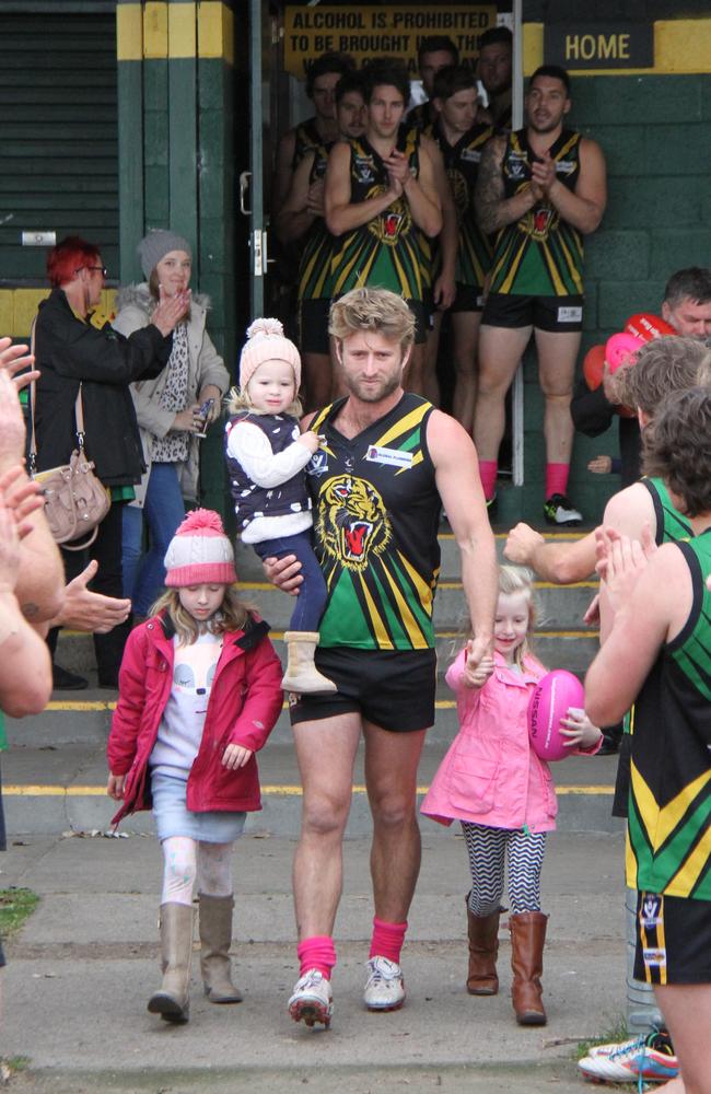 Adam Hunter walking out with his kids after receiving his second cancer setback.