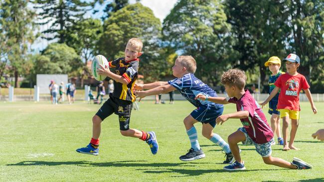 Kids playing touch rugby during Festival of Rugby at Chatswood Oval.