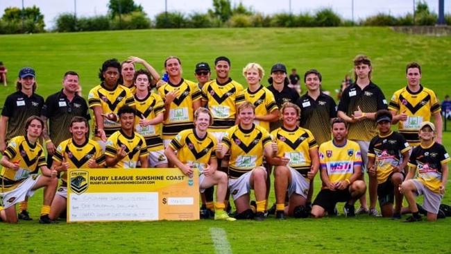 Head coach Kenny Greenway and his under 18s Caloundra Sharks rugby league team celebrate winning the Sunshine Coast 9s tournament.