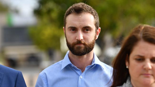 Dreamworld ride operator Timothy Williams (centre) leaving the inquest into the Dreamworld disaster at the Southport Courthouse. Picture: AAP Image/Darren England