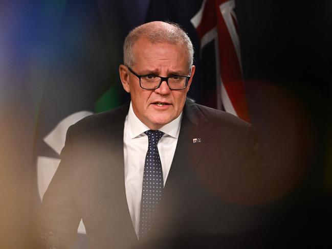 Australia's former prime minister Scott Morrison speaks to media during a press conference in Sydney on August 17, 2022. - Australia's Prime Minister Anthony Albanese on August 16 said that his predecessor Scott Morrison secretly seized control of five ministerial posts, labelling it an "unprecedented trashing of our democracy". (Photo by Steven Saphore / AFP)