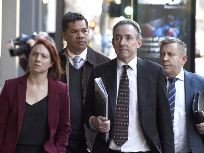 Simiona Tuteru, the Connect Logistics manager, with his lawyers at the Melbourne Magistrates Court. Picture: Andrew Henshaw / NCA NewsWire