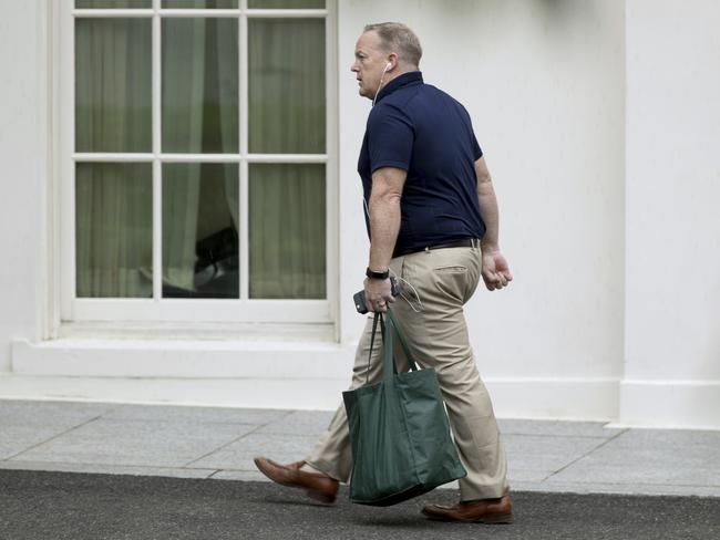 Former White House press secretary Sean Spicer walks out of the West Wing of the White House in Washington. Picture: AP