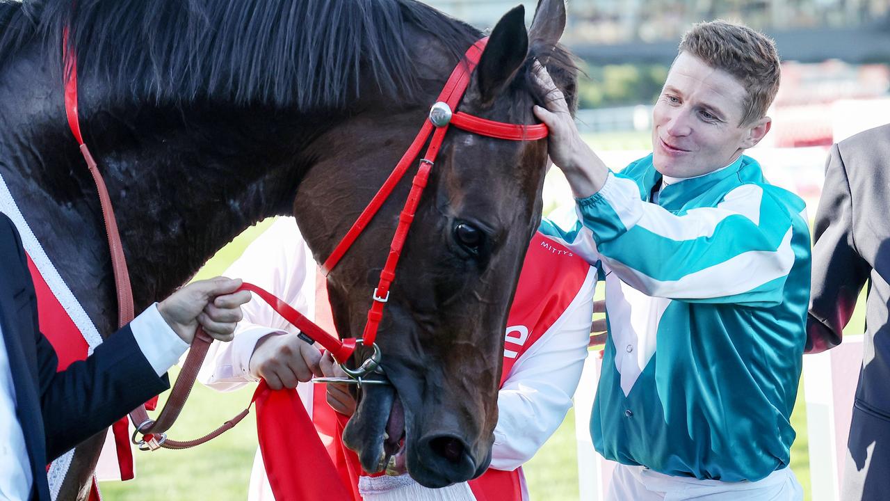 James McDonald and Romantic Warrior (IRE) with connections after winning the Ladbrokes Cox Plate at Moonee Valley Racecourse on October 28, 2023 in Moonee Ponds, Australia. (Photo by George Sal/Racing Photos via Getty Images)