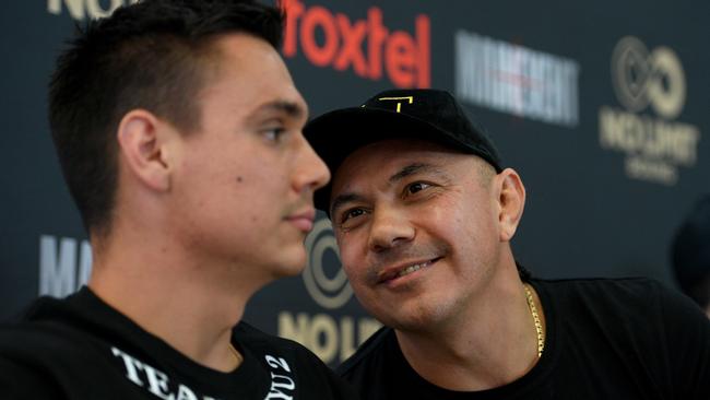 Australian boxing great Kostya Tszyu speaks to his son Tim. AAP Image/Dan Himbrechts.