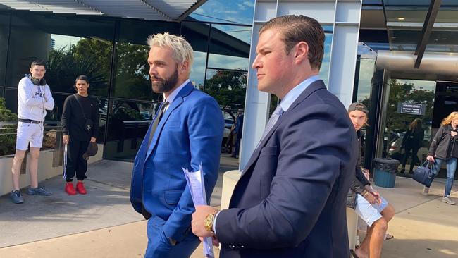 Troy Kenneth Williams, known as 'Candyman 2.0', outside court in Southport with defence lawyer Blake Fraser of Fraser Lawyers last year. Picture: Lea Emery.