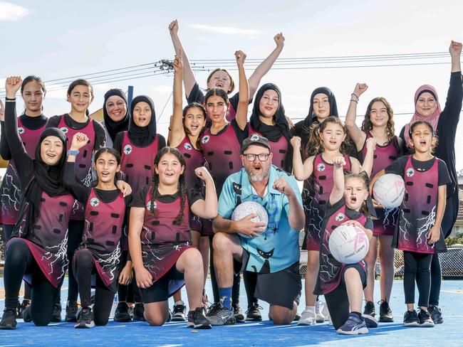 Belle Vue Park Primary School PE teacher Paul Baks with players from the Glenroy school's Panthers netball team. Picture: Tim Carrafa