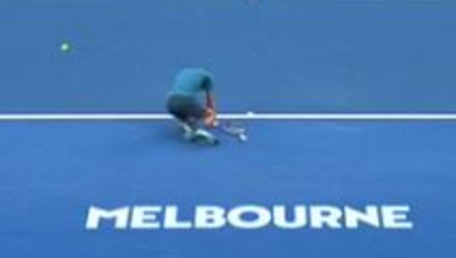 Novak Djokovic hits the deck after copping a tennis ball in the wrong place. Picture: Channel 7