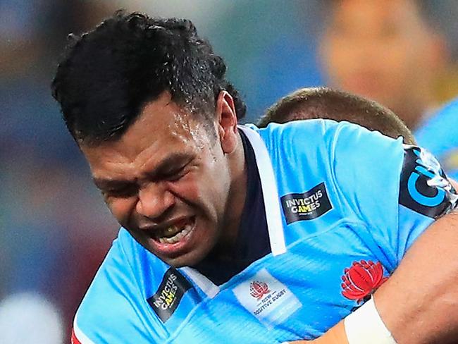 Kurtley Beale of the Waratahs is tackled during the Round 19 Super Rugby match between the NSW Waratahs and the Brumbies at Allianz Stadium in Sydney, Saturday, July 14, 2018. (AAP Image/Jeremy Ng) NO ARCHIVING, EDITORIAL USE ONLY