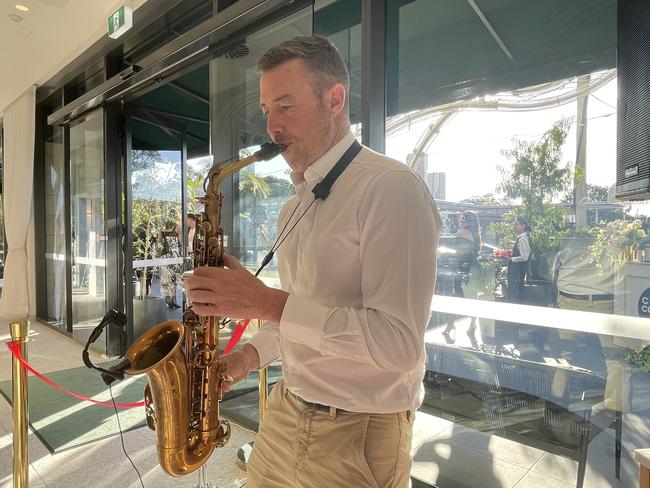 The saxophone player contributed to a vibrant atmosphere.