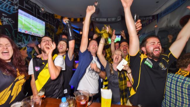 Richmond supporters celebrate the win at The G Bar on Swan St. Picture: Tony Gough
