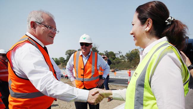 Prime Minister Scott Morrison (left) shakes hands with Queensland Premier Annastacia Palaszczuk during a visit to a construction site in the suburb of Rochedale, in Brisbane, in 2019.