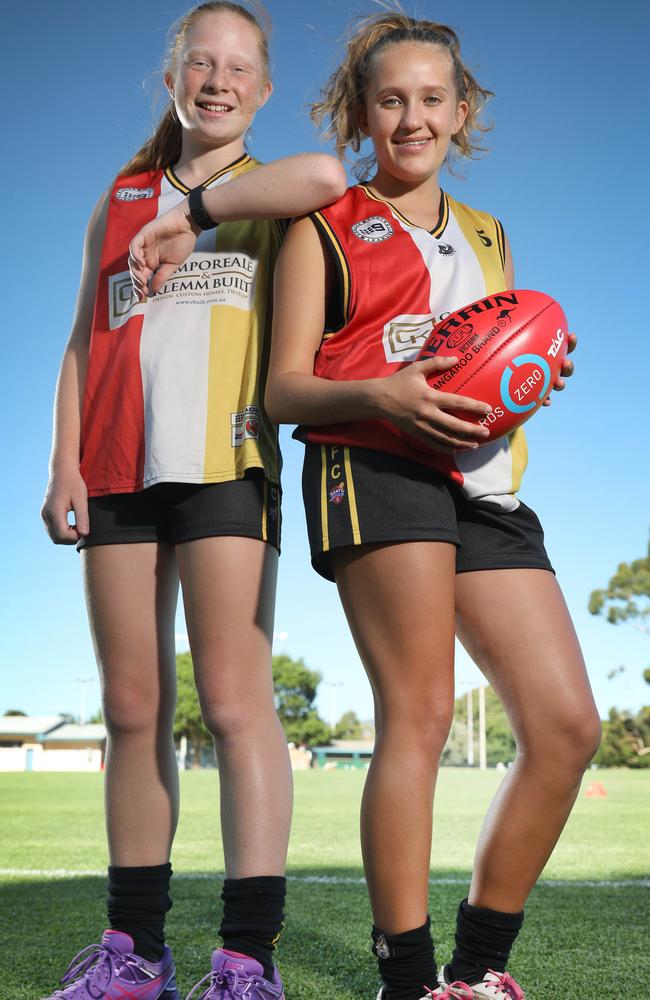 PLAY ON: Goodwood Saints juniors Jess Shyer, 13, and Mim Potter, 15, are part of a club adjusting to the explosive growth in female footy participation.  Picture: DEAN MARTIN/AAP
