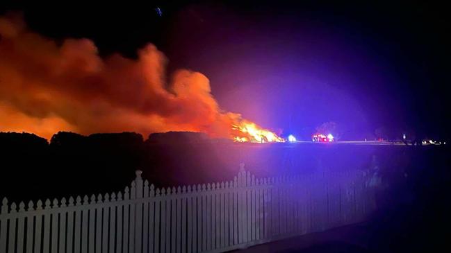 One of the photos posted to social media on Monday night as the fire ripped through a 100m sq area of Windermere Park near Rifle Range Beach. Police fire the Queensland Fire Department are investigating the cause.